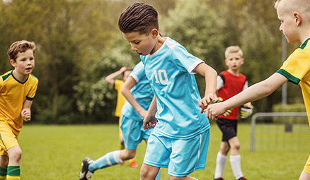 boy playing soccer