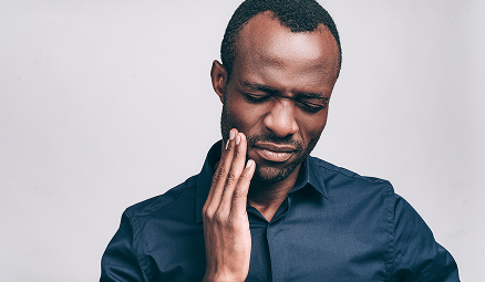 man with mouth pain