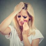 Woman in distress over toothache.